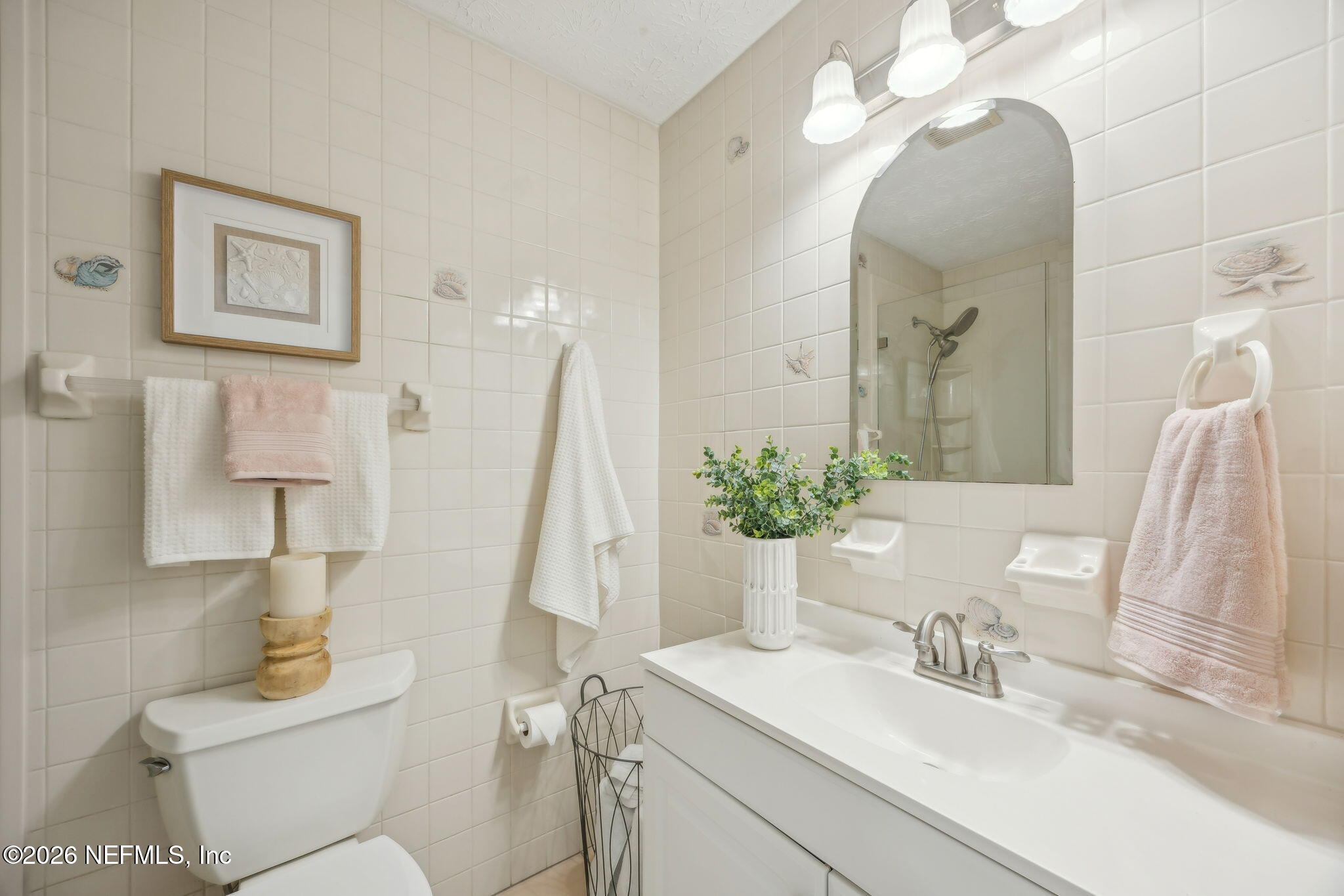 600 Davis Street Neptune Beach, FL 32266 - Photo 18 of 33 a bathroom with a sink toilet and shower