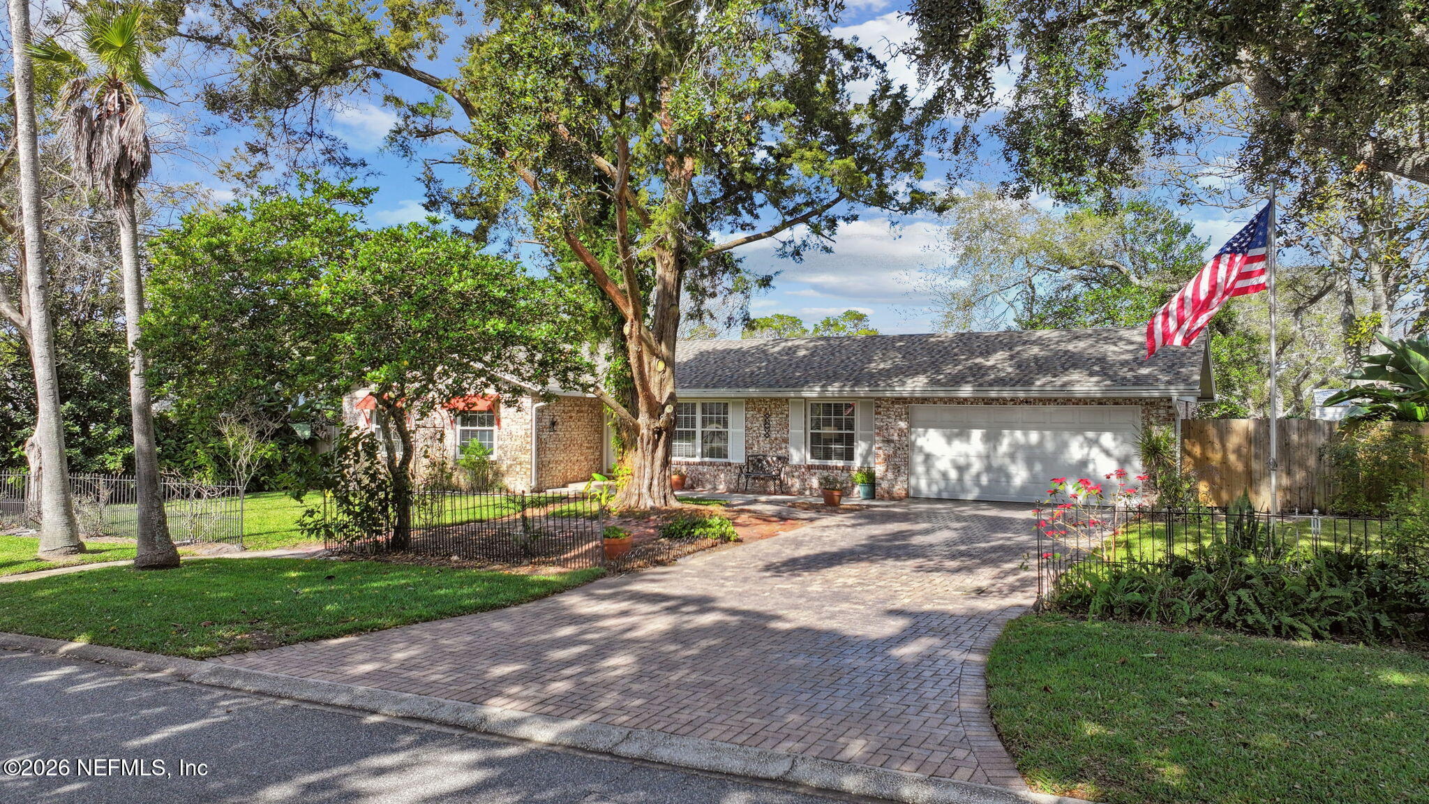 600 Davis Street Neptune Beach, FL 32266 - Photo 2 of 33 a view of a building with a yard