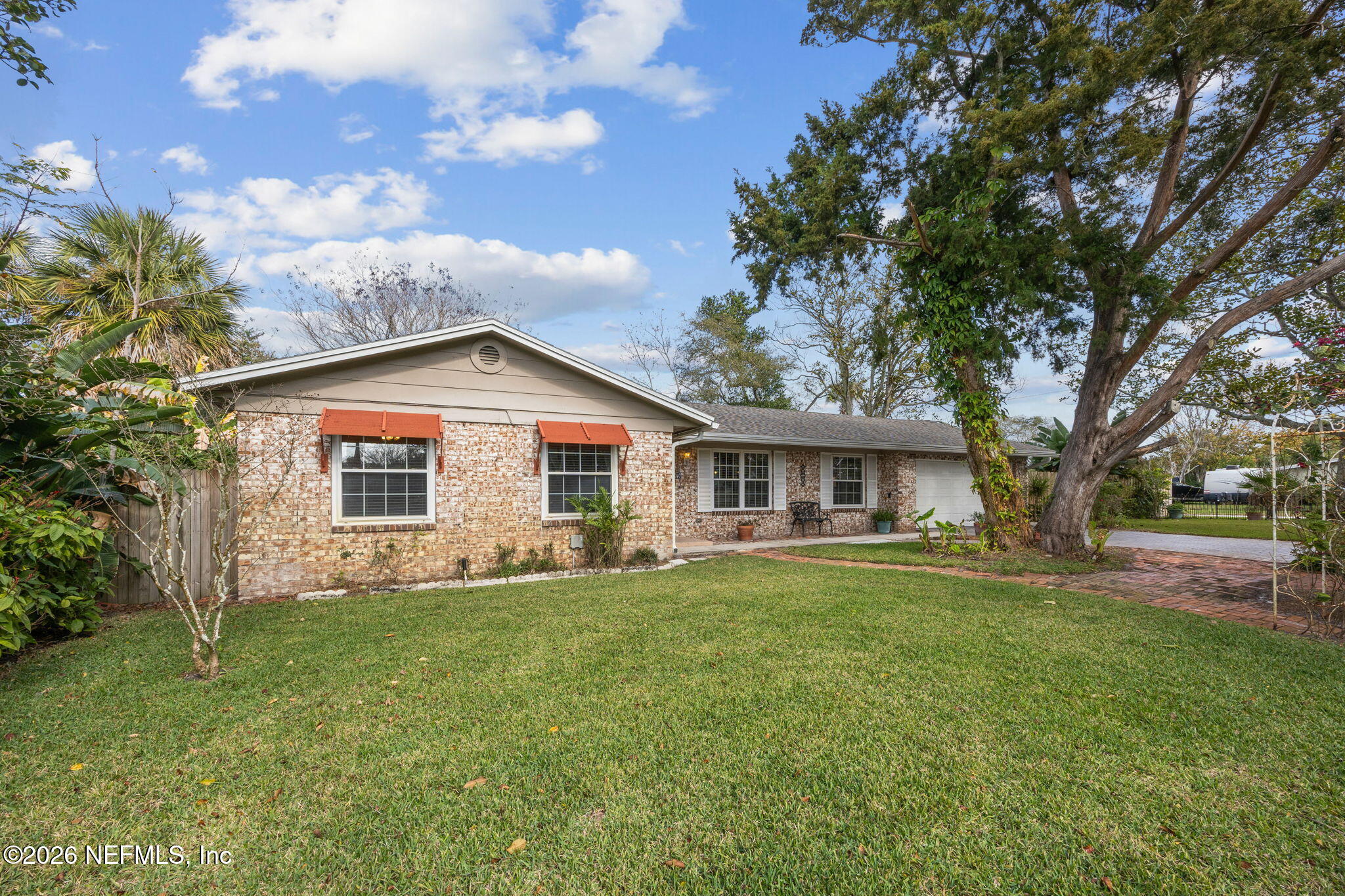 600 Davis Street Neptune Beach, FL 32266 - Photo 26 of 33 a front view of house with yard and green space