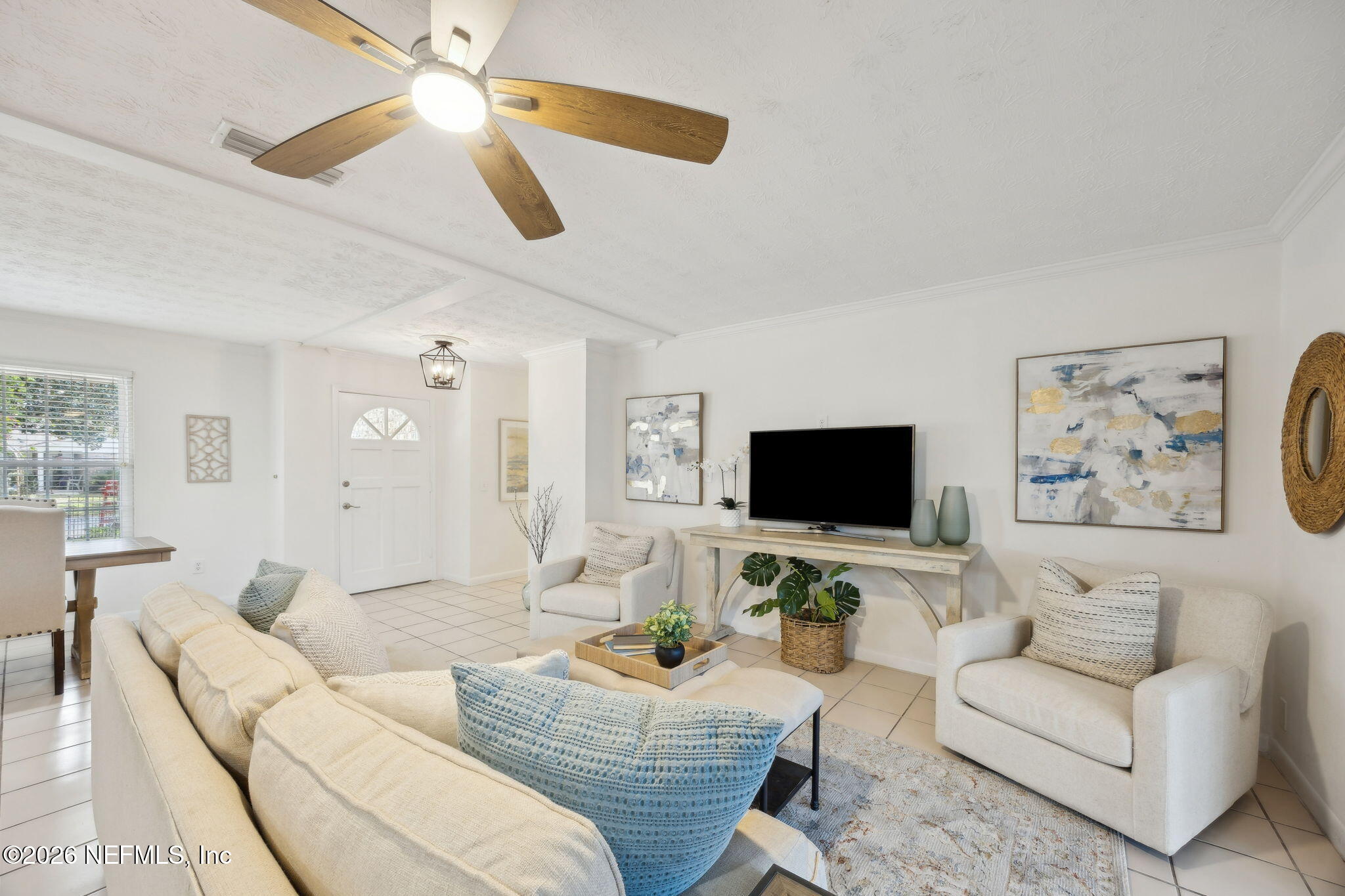 600 Davis Street Neptune Beach, FL 32266 - Photo 10 of 33 a living room with furniture and a flat screen tv