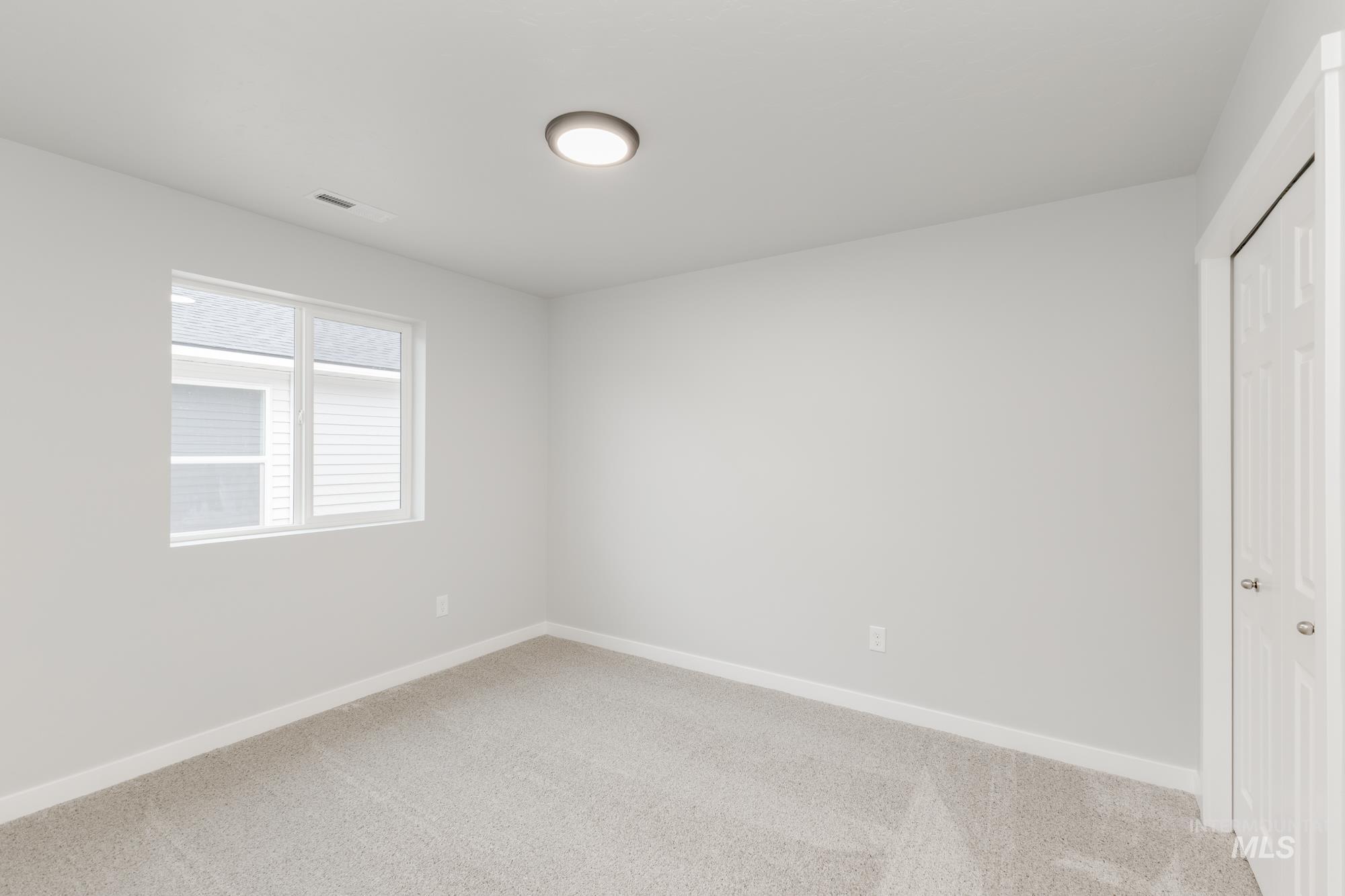 16264 Fill Avenue Caldwell, ID 83607 - Photo 11 of 18 Unfurnished bedroom with a closet and carpet floors