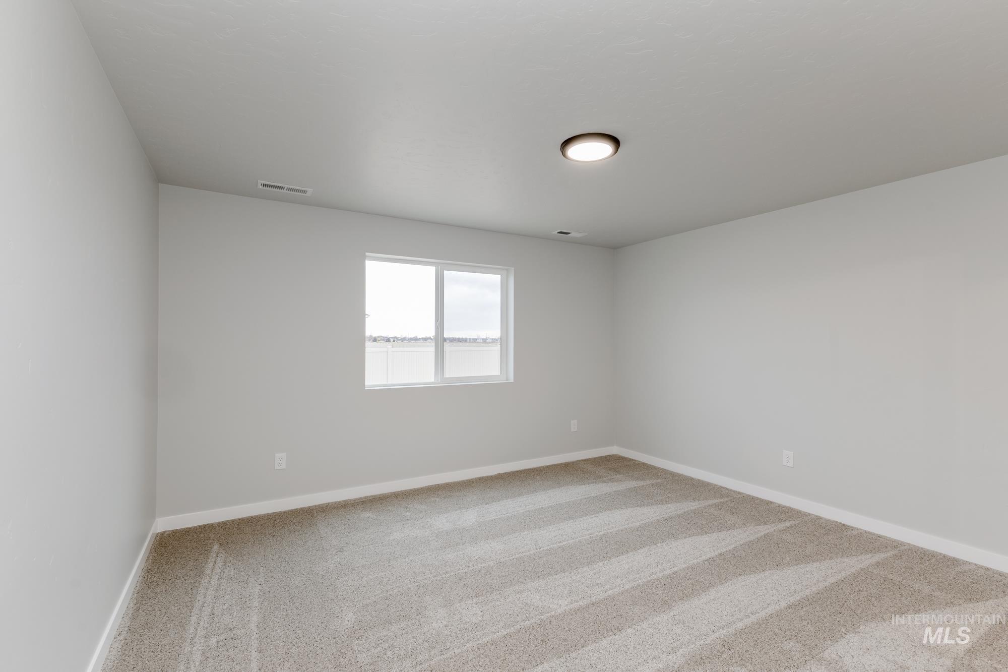 16264 Fill Avenue Caldwell, ID 83607 - Photo 14 of 18 Unfurnished room featuring light carpet and baseboards