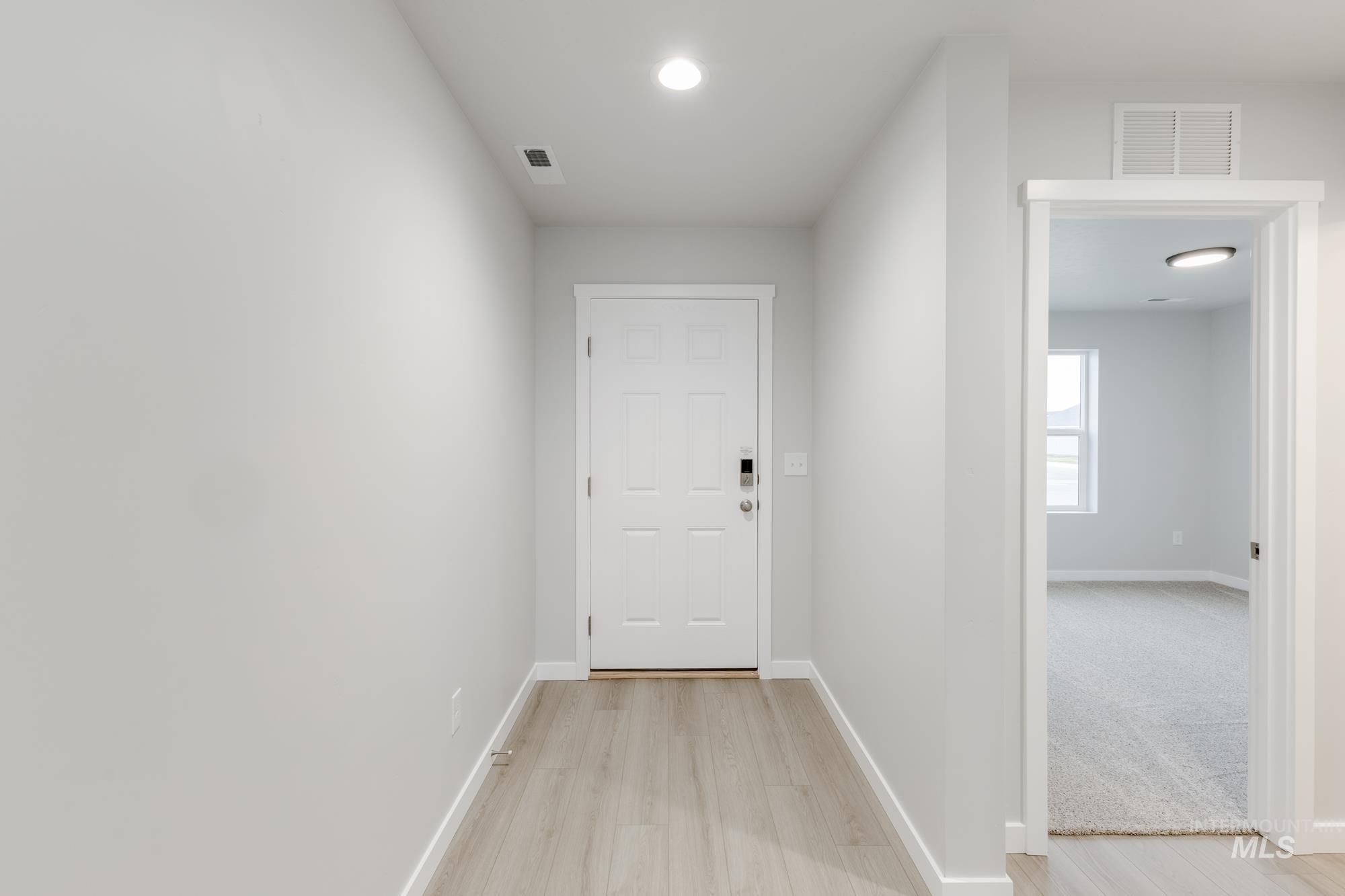 16264 Fill Avenue Caldwell, ID 83607 - Photo 2 of 18 Doorway with wood finished floors and recessed lighting