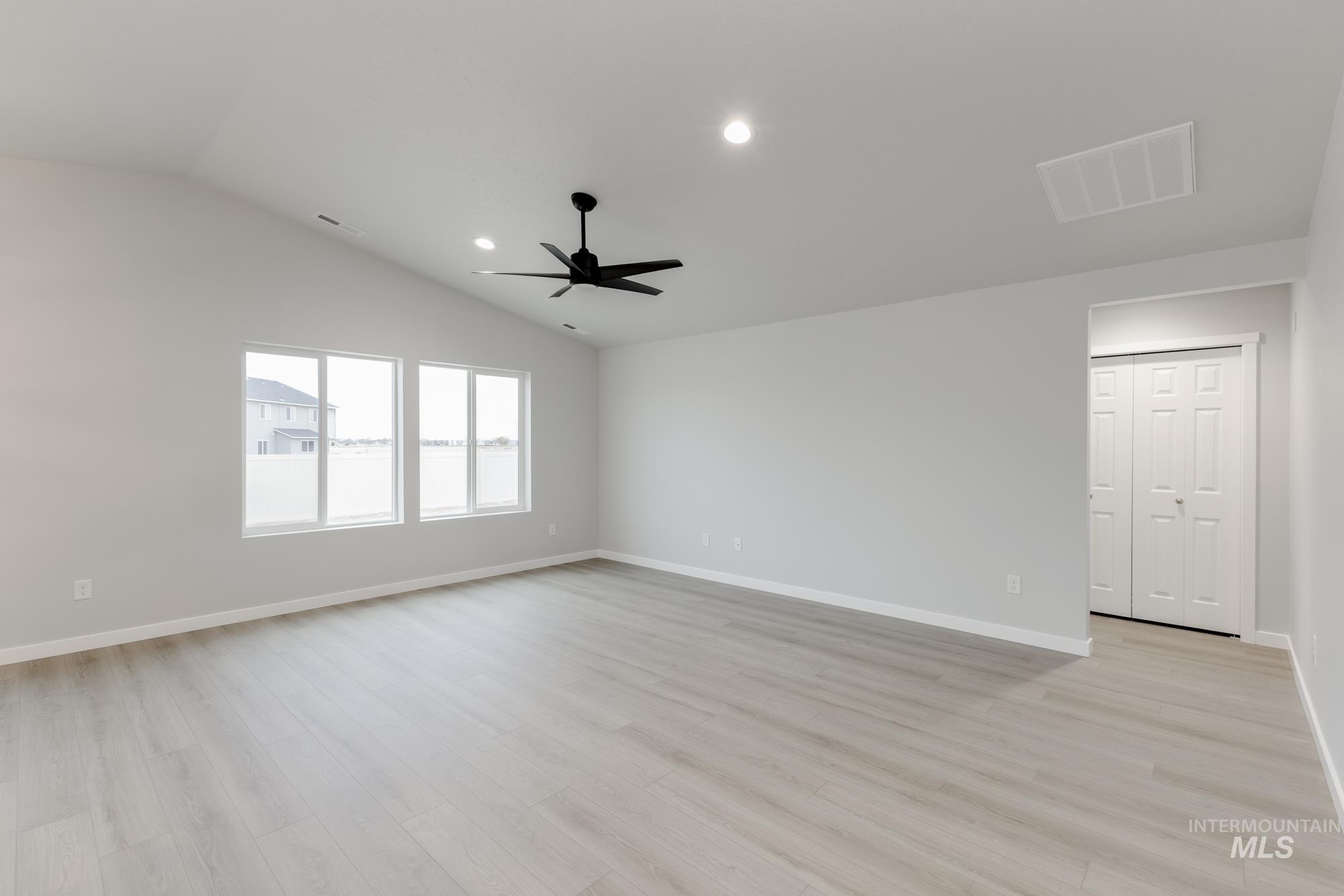16264 Fill Avenue Caldwell, ID 83607 - Photo 7 of 18 Unfurnished room featuring light wood-style floors, recessed lighting, lofted ceiling, and a ceiling fan