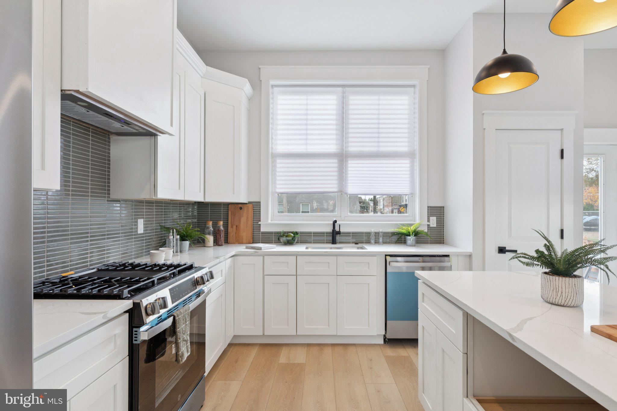 2800 Bridge Street Philadelphia, PA 19137 - Photo 12 of 51 a kitchen with a sink stove and cabinets