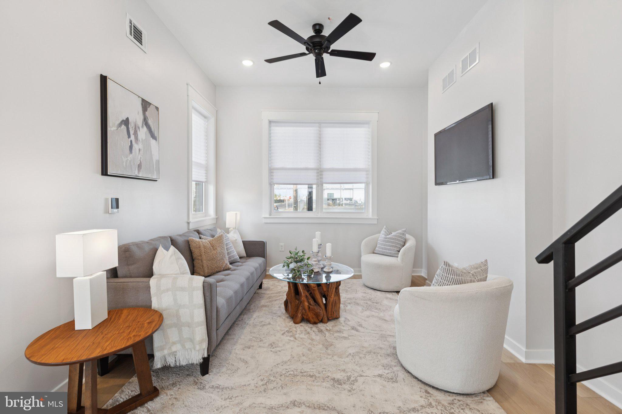 2800 Bridge Street Philadelphia, PA 19137 - Photo 18 of 51 a living room with furniture a flat screen tv and a window