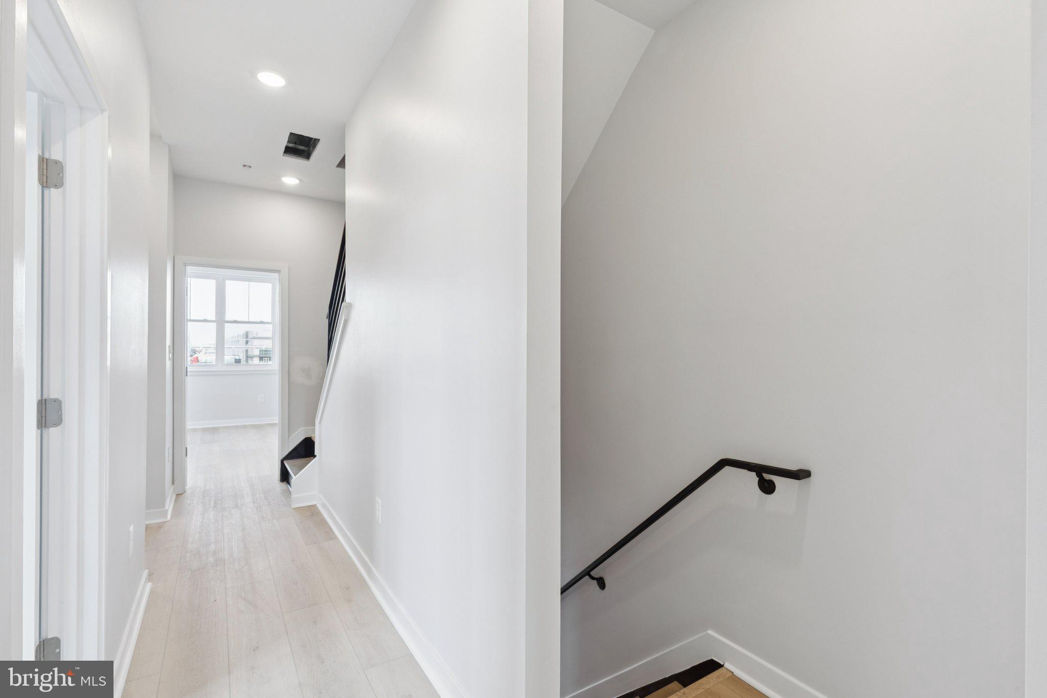 2800 Bridge Street Philadelphia, PA 19137 - Photo 28 of 51 a view of a hallway with a white walls and stairs