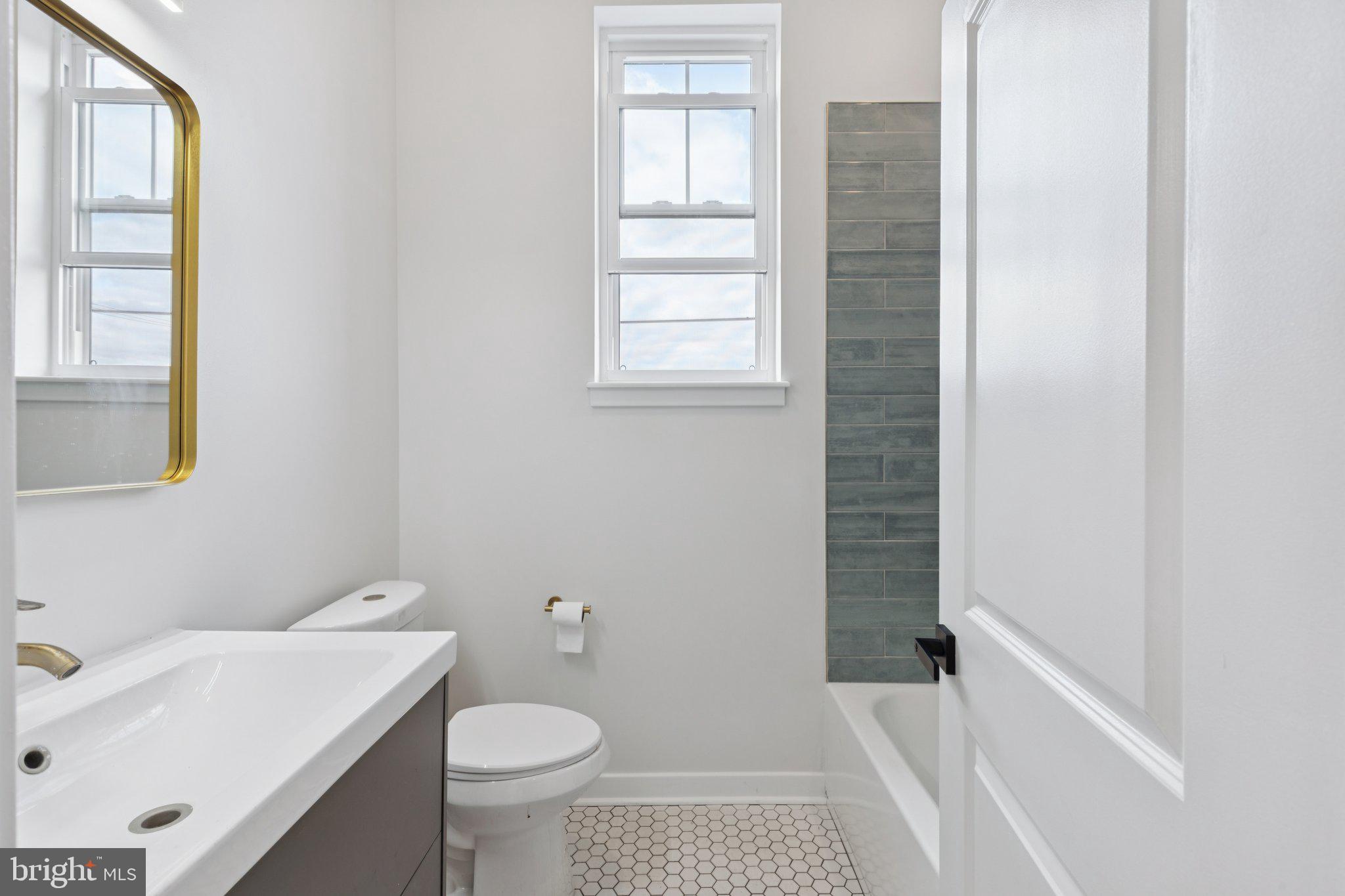 2800 Bridge Street Philadelphia, PA 19137 - Photo 31 of 51 a bathroom with a sink toilet and window