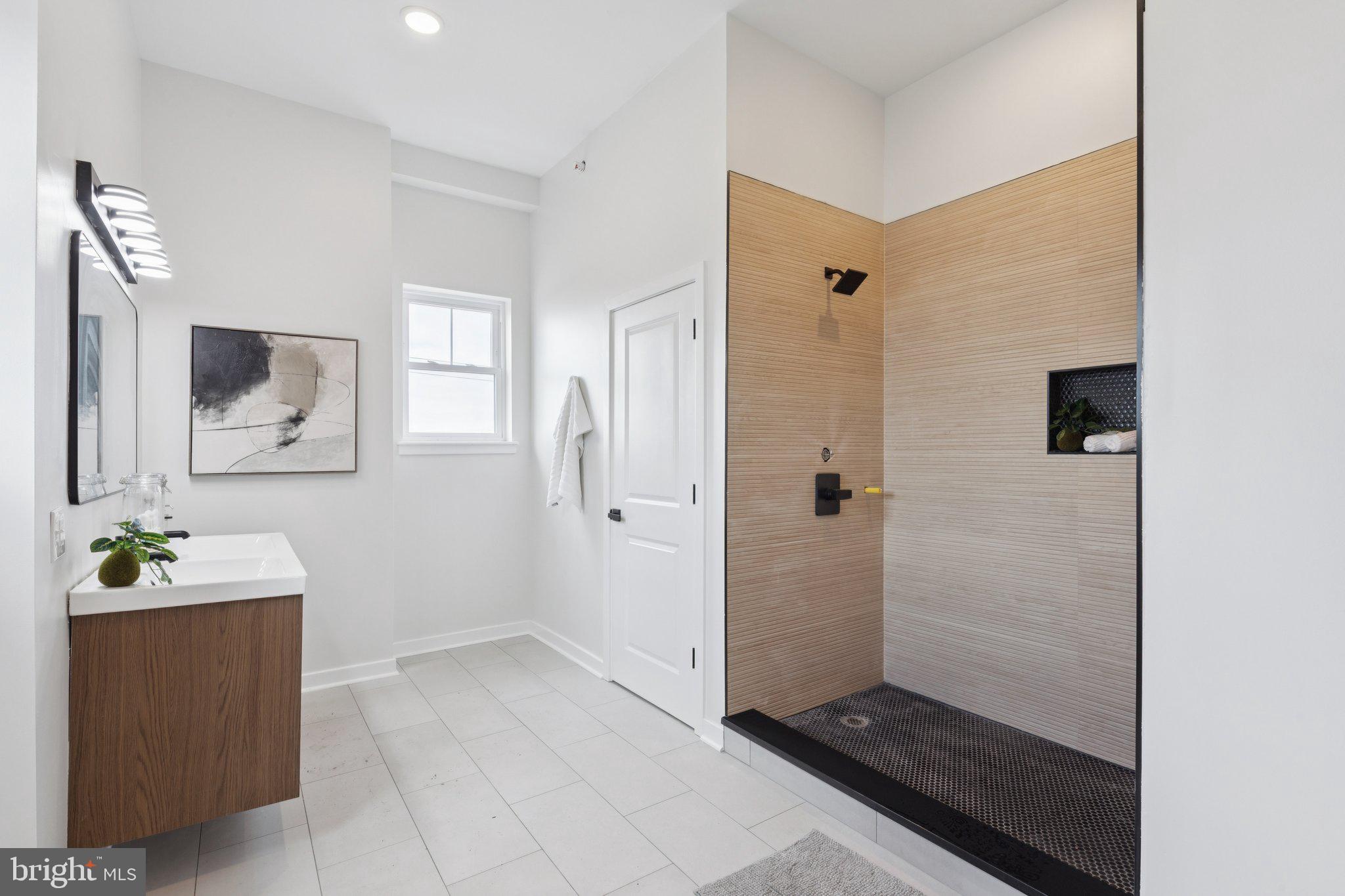 2800 Bridge Street Philadelphia, PA 19137 - Photo 44 of 51 a bathroom with a sink and mirror
