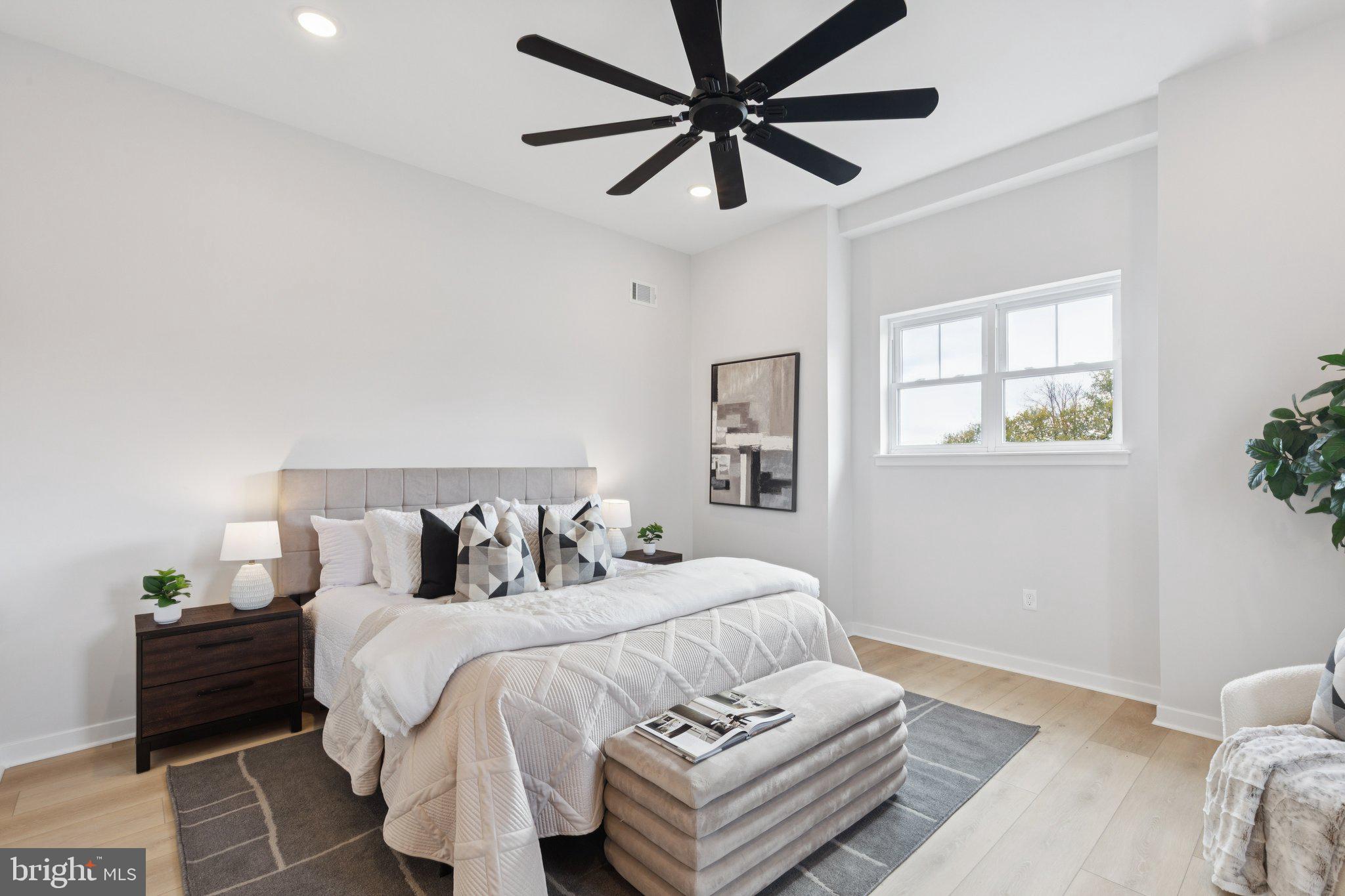 2800 Bridge Street Philadelphia, PA 19137 - Photo 50 of 51 a bedroom with a bed and a chandelier