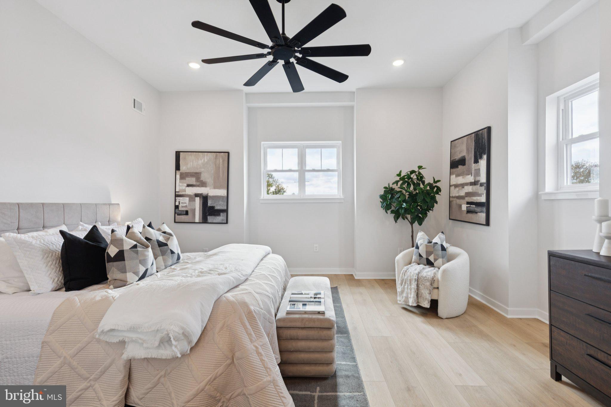 2800 Bridge Street Philadelphia, PA 19137 - Photo 51 of 51 a bedroom with a bed and a potted plant