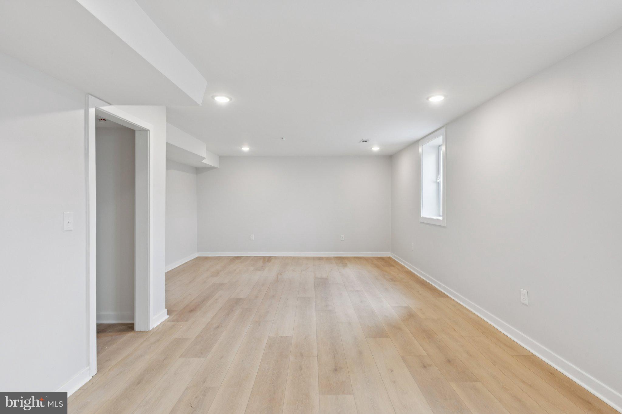 2800 Bridge Street Philadelphia, PA 19137 - Photo 6 of 51 an empty room with wooden floor and windows
