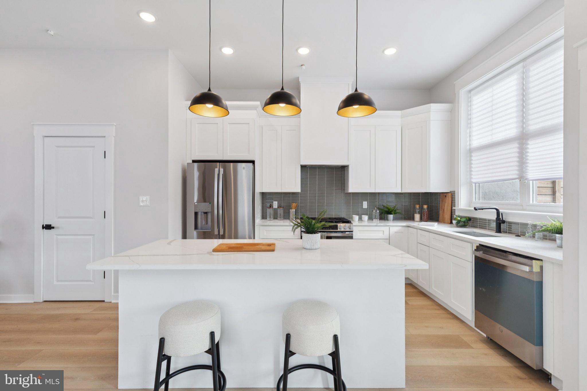 2800 Bridge Street Philadelphia, PA 19137 - Photo 9 of 51 a kitchen with cabinets and stainless steel appliances