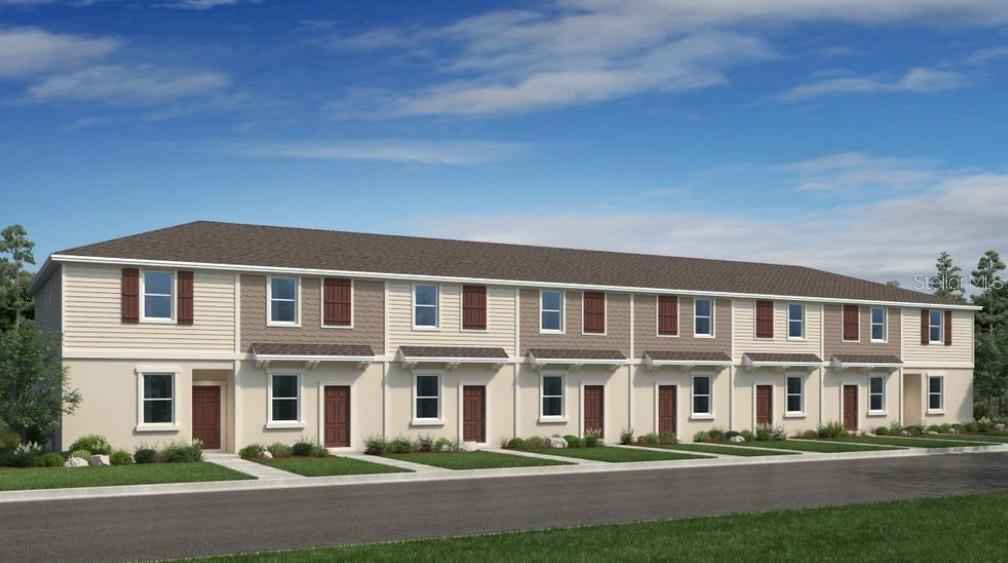 14064 Textile Run Parrish, FL 34219 - Photo 1 of 22 a front view of a building with lot of windows