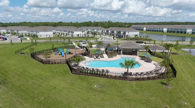 a view of a park with swings and slides