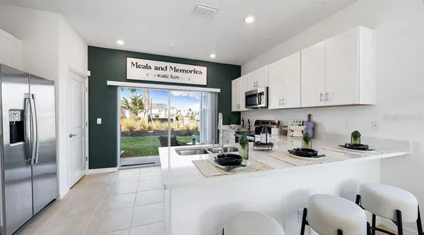 a bedroom with bed and window