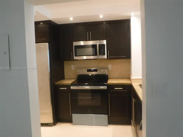 a kitchen with a sink and a microwave