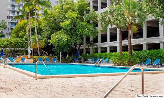 a view of a swimming pool with a patio