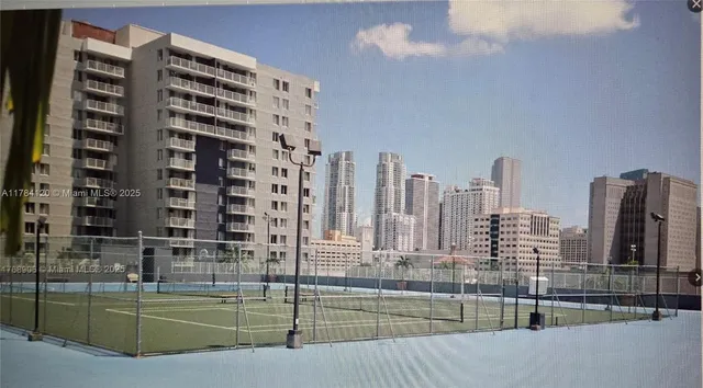 a living room with furniture and gym equipment