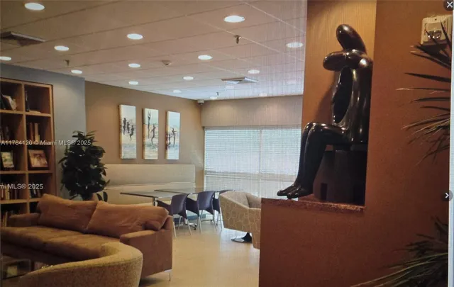 front view of a building with a garden