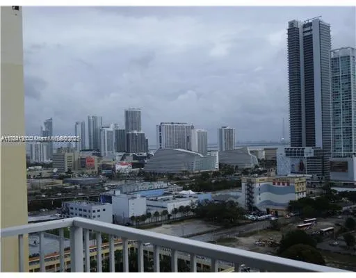 a view of a swimming pool with sitting area and furniture