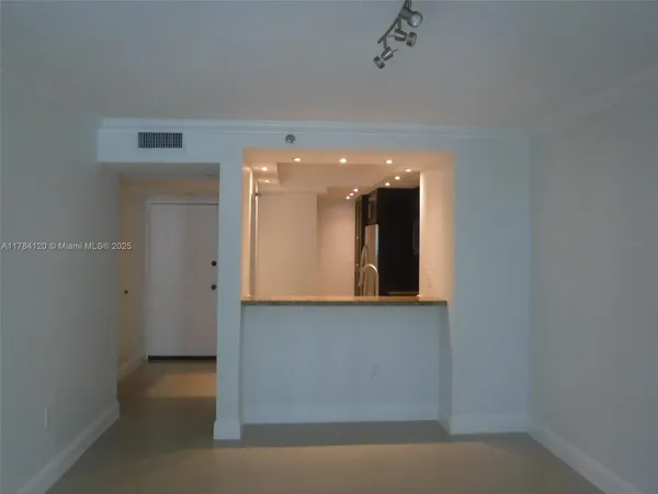 a view of a hallway with entryway