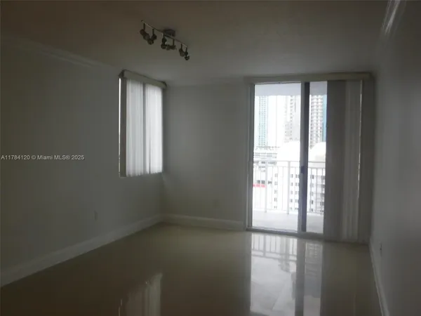 a view of an empty room with a window