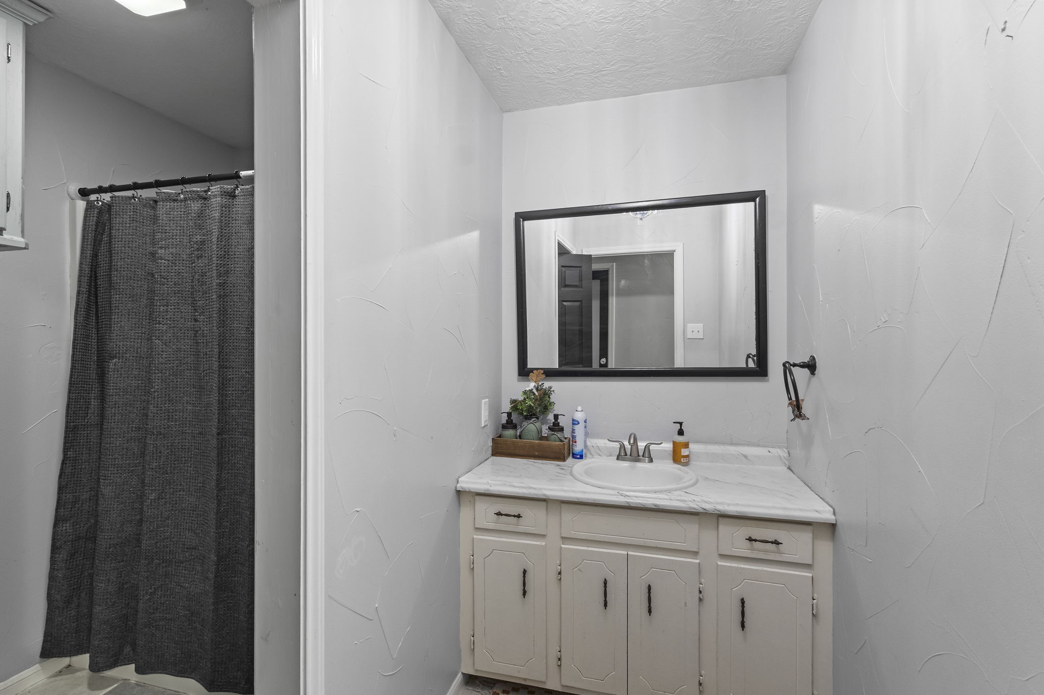 125 Williams Road Lumberton, TX 77657 - Photo 14 of 22 a bathroom with a granite countertop sink and a mirror