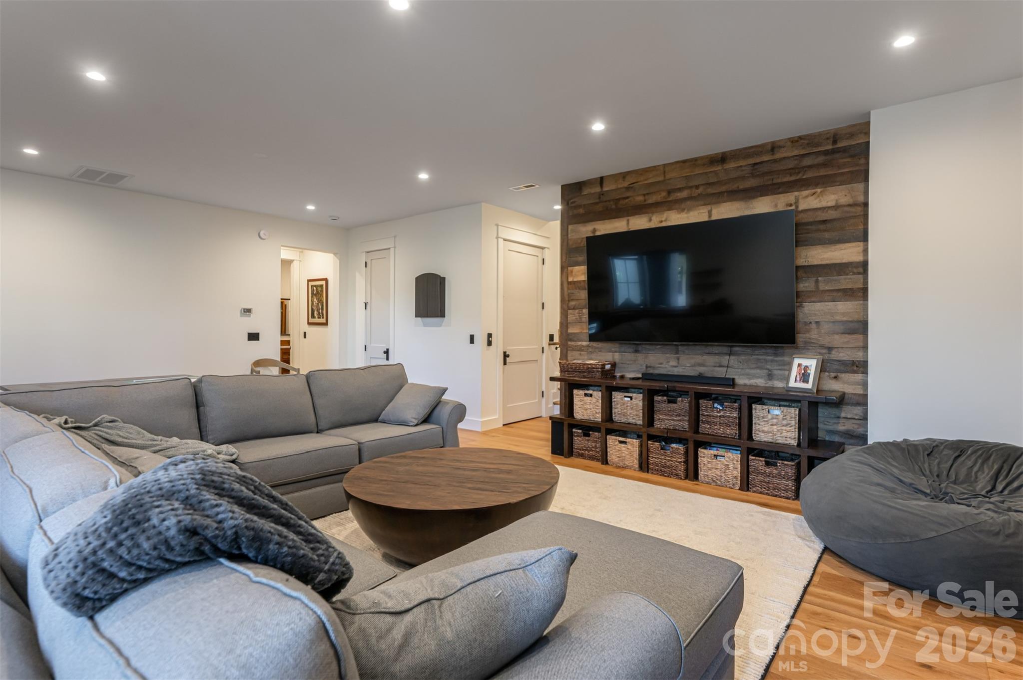 25 Rantis Lane Black Mountain, NC 28711 - Photo 46 of 48 a living room with furniture and a flat screen tv