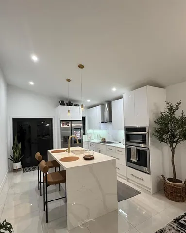 a bathroom with a sink and cabinets