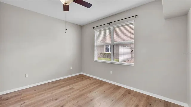 a bathroom with a sink double vanity granite tub and a mirror