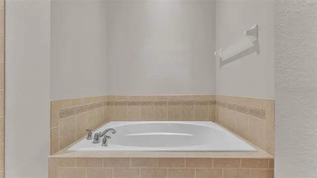 a bathroom with bathtub and shower