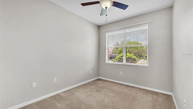 a bathroom with a sink vanity mirror and toilet