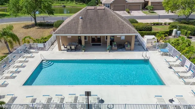 a view of swimming pool and a yard