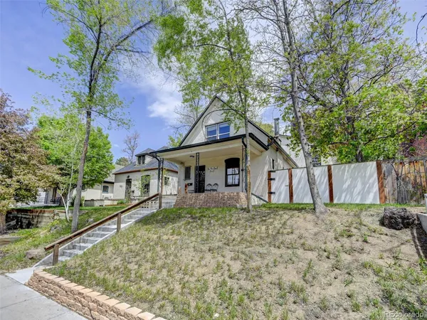 a house with a tree in front of it