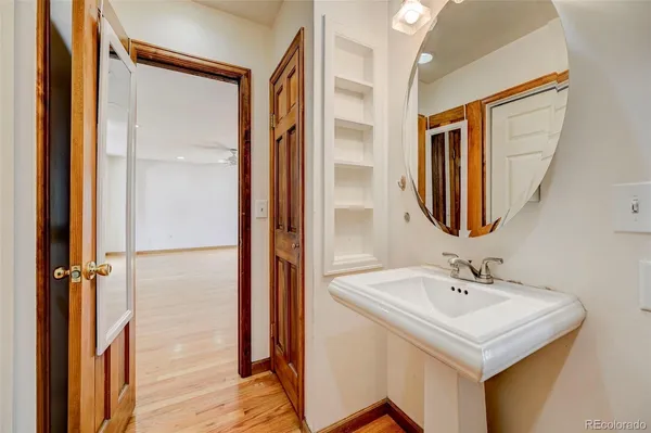 a bathroom with a sink a mirror and a shower