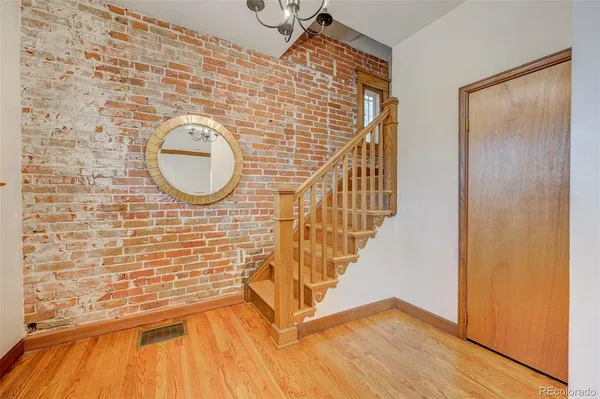 a view of entryway with wooden floor
