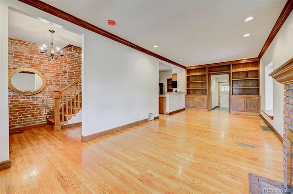 a view of an empty room with closet