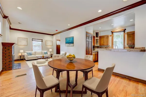 a dining room with furniture and window