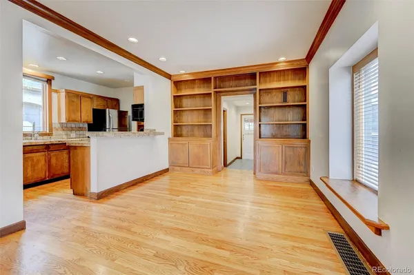 a view of kitchen with cabinets and wooden floor