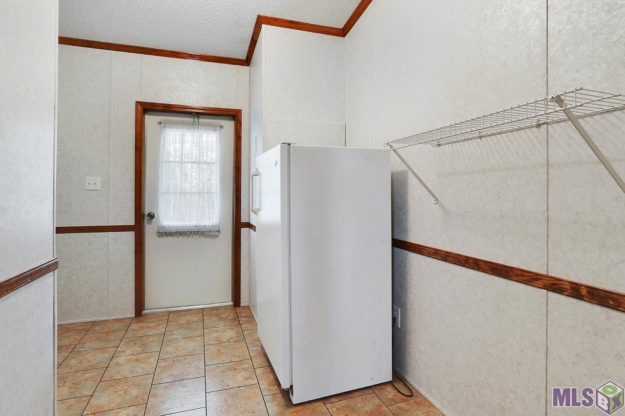 14014 Ceazer Road Gonzales, LA 70737 - Photo 12 of 13 Laundry Room - Storage Area