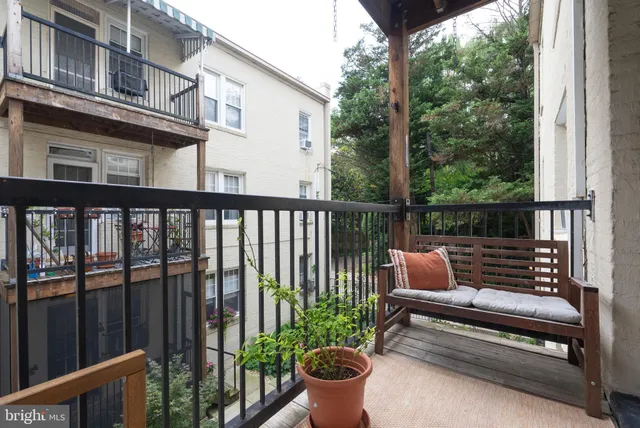 a view of a two chairs in the balcony