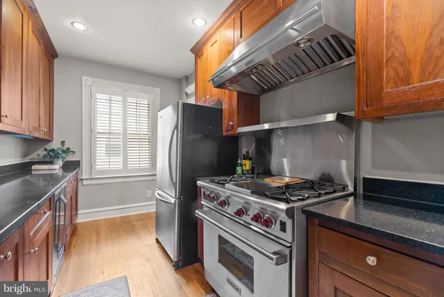a kitchen with a stove and a refrigerator