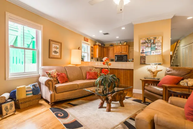 a spacious bedroom with a bed and a chandelier