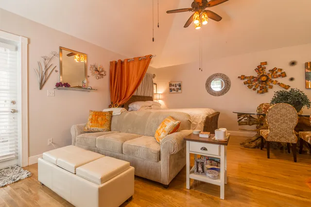 a view of a balcony with furniture and front door