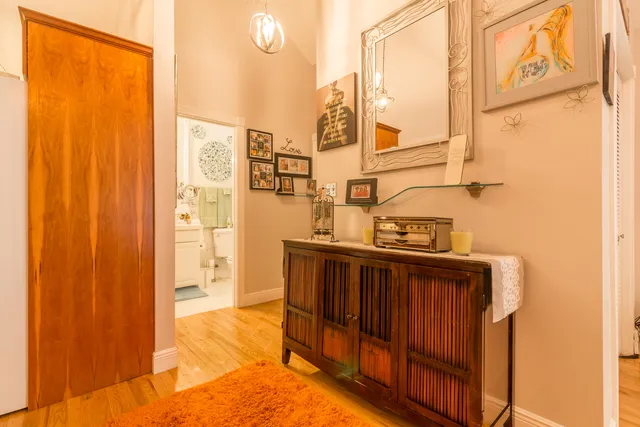 a bathroom with a sink mirror vanity and toilet