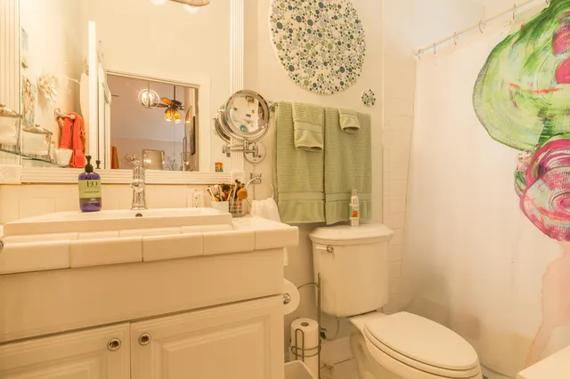 a living room filled with furniture and a floor to ceiling window