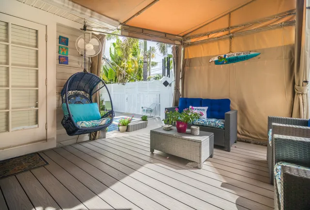a backyard of a house with table and chairs