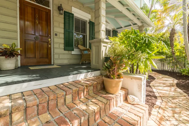 a kitchen with a sink a stove and cabinets