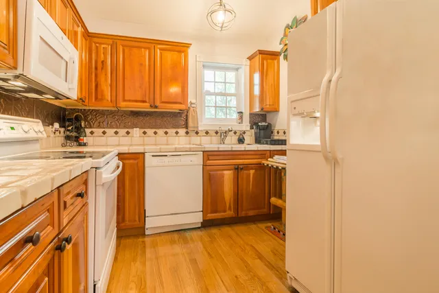 a view of yard with swimming pool and sitting area